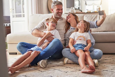 family laughing and having fun in pest free home